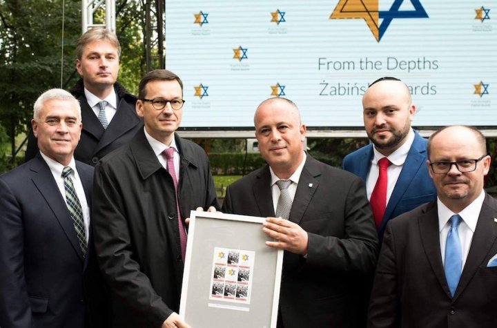 Mateusz-Morawiecki.-3rd-from-left-holding-a-document-honoring-rescuers-of-Jews-at-Warsaw-Zoo-on-Sept-18-2017.-Courtesy-of-From-the-Depths-1.jpg